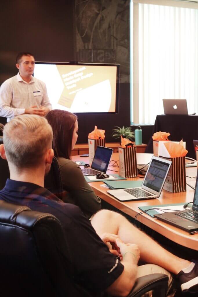 Person presenting to a small meeting