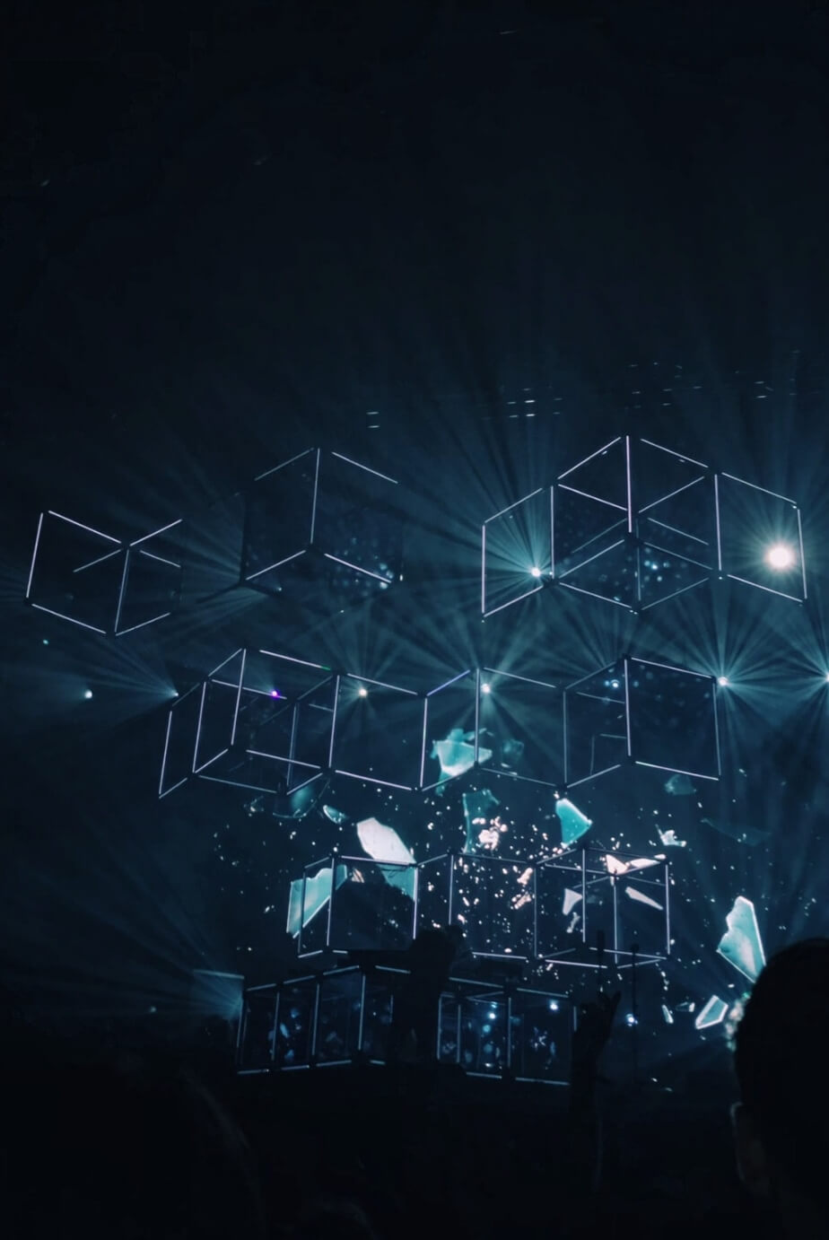 abstract image of cubes and lights shining amongst the darkness